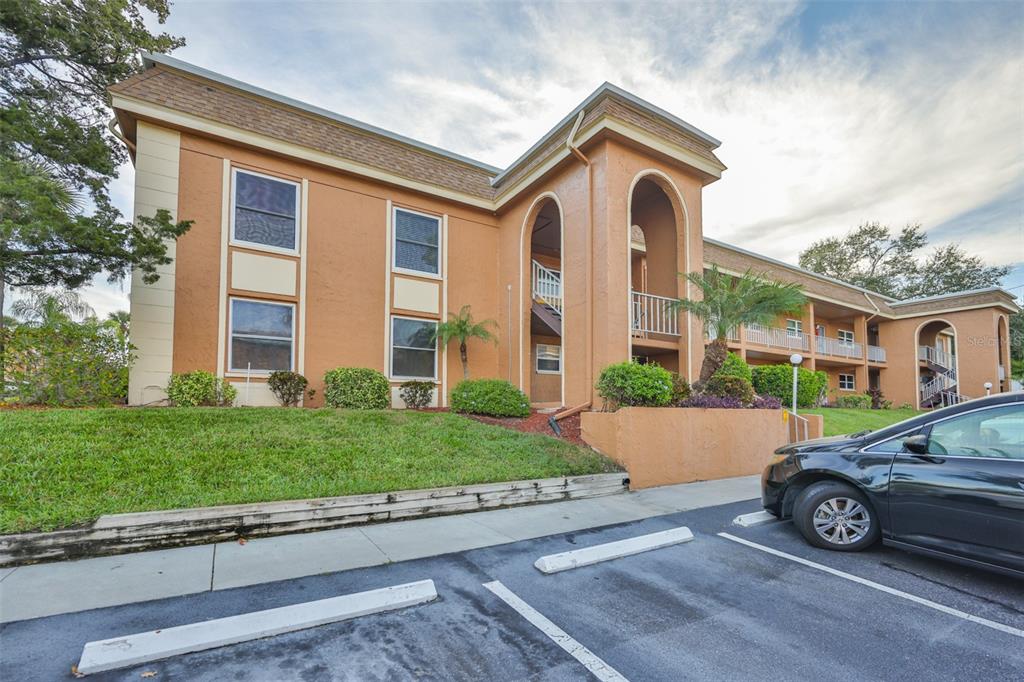 12760 Indian Rocks Road, Unit 413 Largo, FL 33774 - Photo 3 of 27 front view of a house with a yard