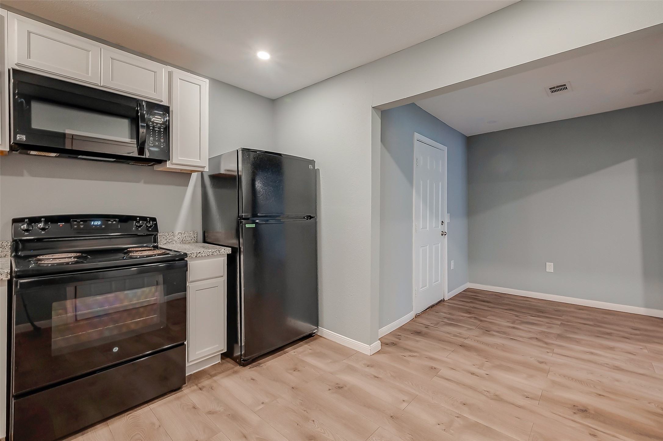 6823 Goforth Street Houston, TX 77021 - Photo 11 of 29 a kitchen with stainless steel appliances and wooden cabinets
