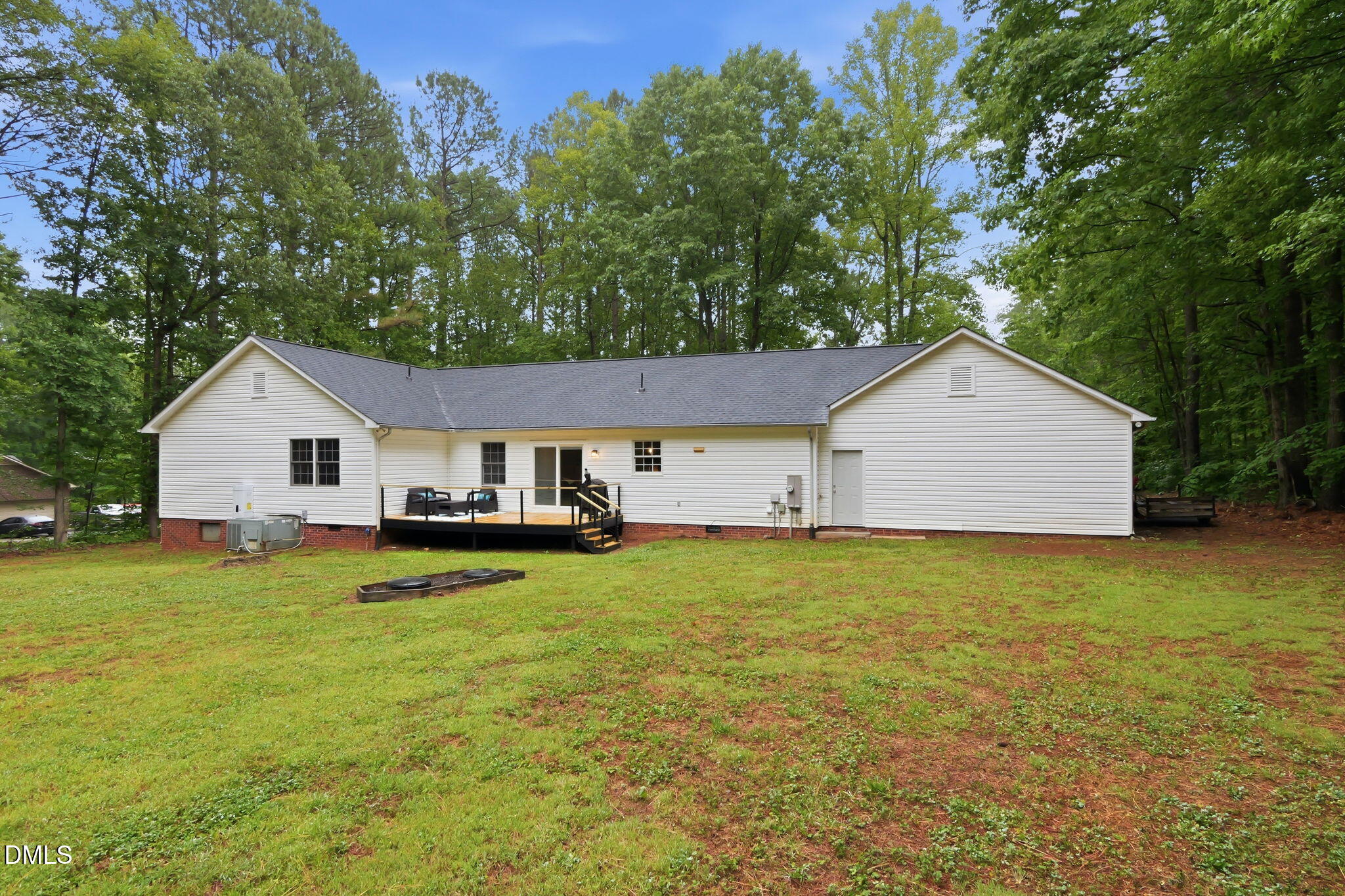 1925 Old Allensville Road Roxboro, NC 27574 - Photo 14 of 58 a house view with a garden and wooden fence