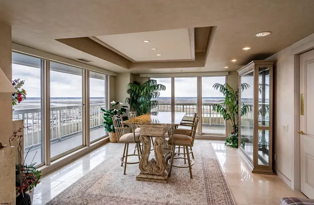 a view of a dining room with furniture window and outside view