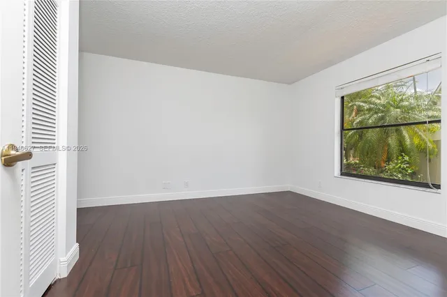 a bathroom with a double vanity sink mirror and bathtub