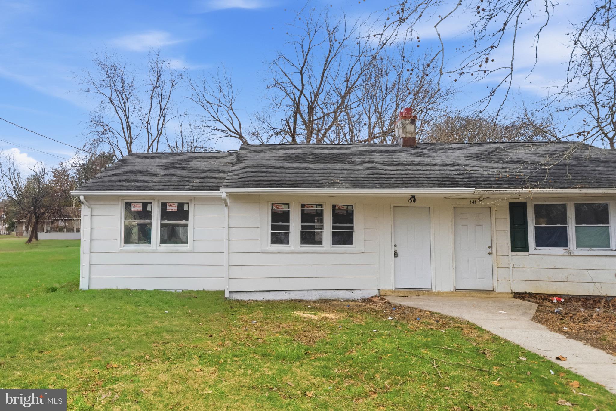 front view of a house with a yard