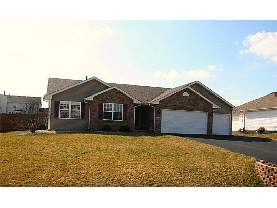 10980 Chicory Ridge Way Roscoe, IL 61073 - Photo 1 of 11 a view of front of a house with a yard