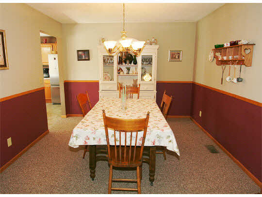 10980 Chicory Ridge Way Roscoe, IL 61073 - Photo 4 of 11 a view of a dining room with furniture and wooden floor