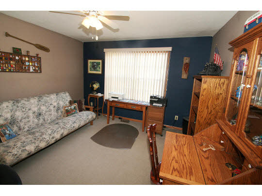 10980 Chicory Ridge Way Roscoe, IL 61073 - Photo 9 of 11 a living room with furniture and a flat screen tv