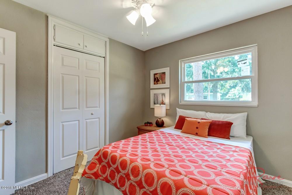 6758 Orkney Road Jacksonville, FL 32211 - Photo 17 of 23 a bedroom with a large bed and a window