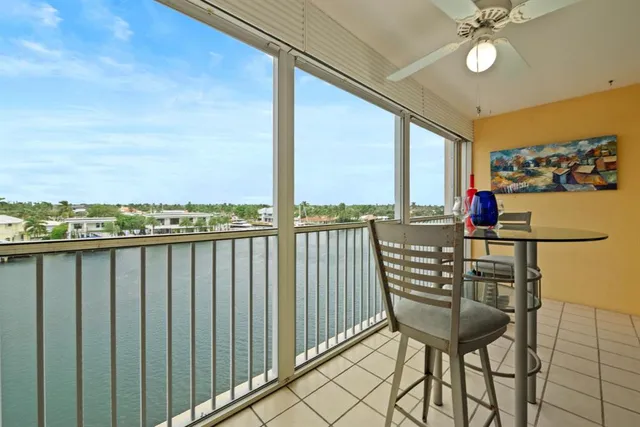 a view of a balcony with chairs