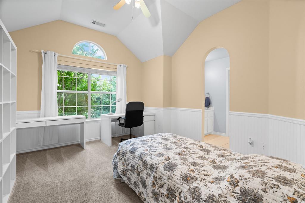 2703 Pottery Trail Corinth, TX 76210 - Photo 27 of 40 a bedroom with a bed and a large window