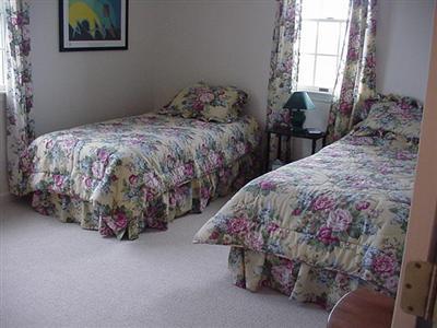 12 Knowles Heights Road Truro, MA 02666 - Photo 6 of 14 a bedroom with a bed and a painting on the wall