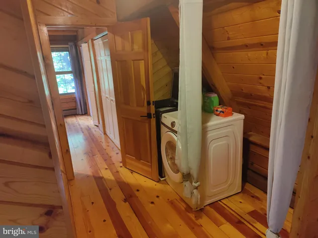 a view of a balcony with wooden floor and staircase