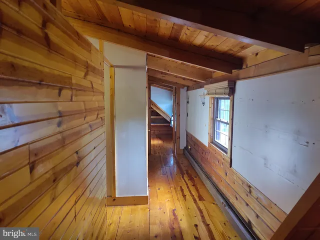 a view of entryway with wooden floor