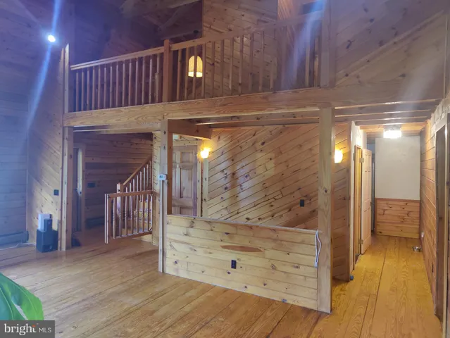 a view of room with wooden floor