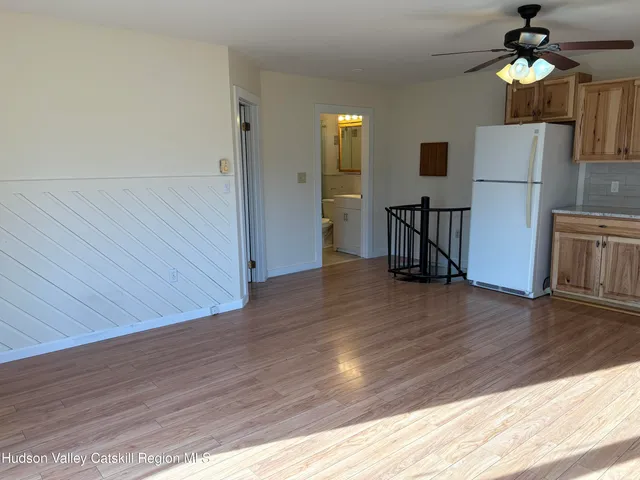 a view of a kitchen from the hallway