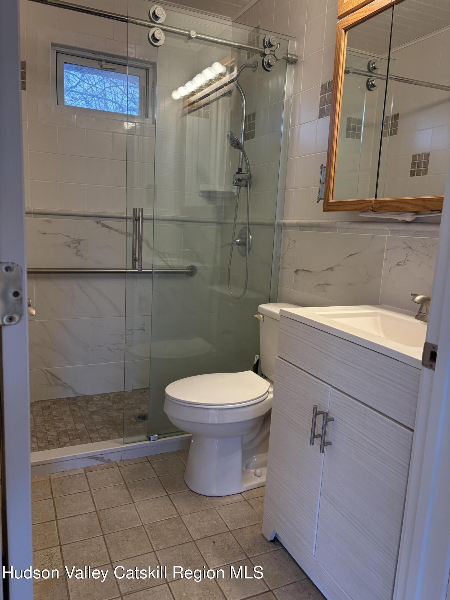 505 Highway 208, Unit 3 Gardiner, NY 12525 - Photo 9 of 11 a bathroom with a toilet and a sink