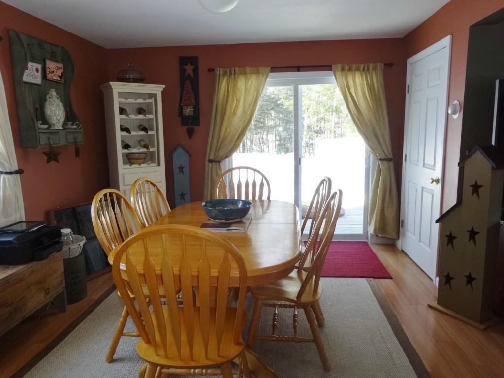 345 Lily Road Dedham, ME 04429 - Photo 10 of 35 The spacious dining area has sliding...