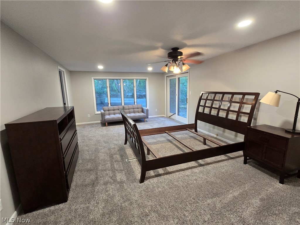 86450 Beaver Dam Road Scio, OH 43988 - Photo 17 of 28 Carpeted flooring throughout, recessed lighting, ceiling fan light fixture, sliding glass door, and large window