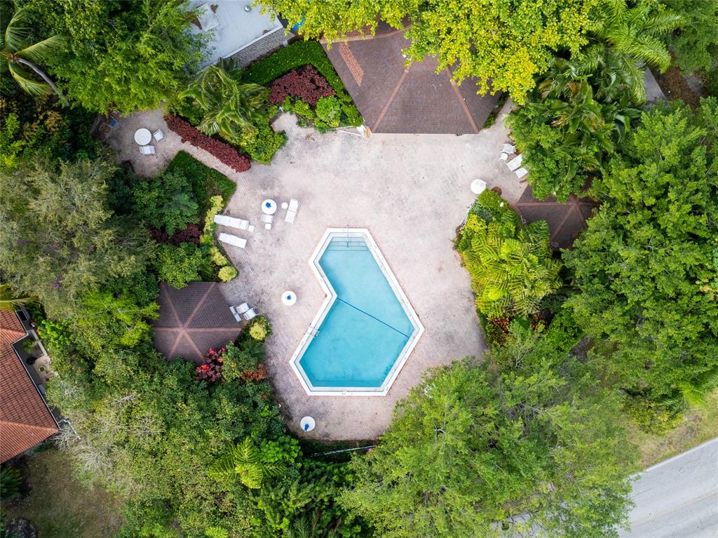 2850 North Palm Aire Drive, Unit 601 Pompano Beach, FL 33069 - Photo 8 of 41 an aerial view of a house with a yard and trees