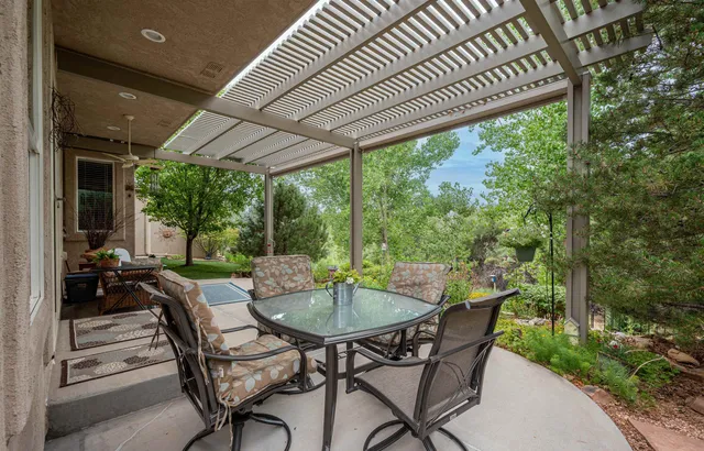 a dining room with furniture and outdoor space