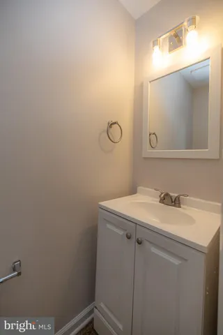 a bathroom with a sink and vanity
