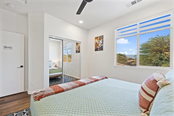 a bedroom with furniture and a window