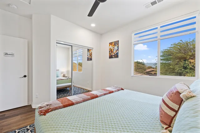 a bedroom with furniture and a window