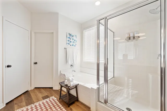 a view of entryway and hall with wooden floor