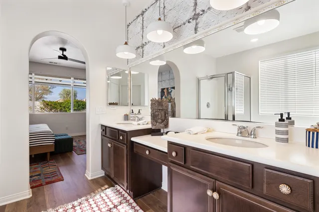 a room with pool table windows and wooden floor