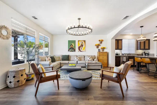 a view of a patio with table and chairs and wooden floor