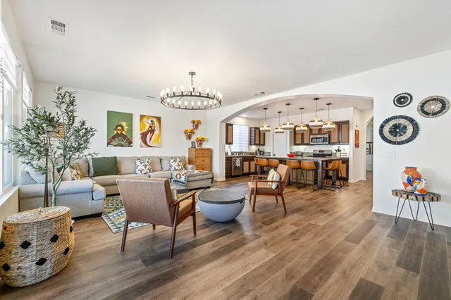 a view of a patio with table and chairs potted plants with wooden floor