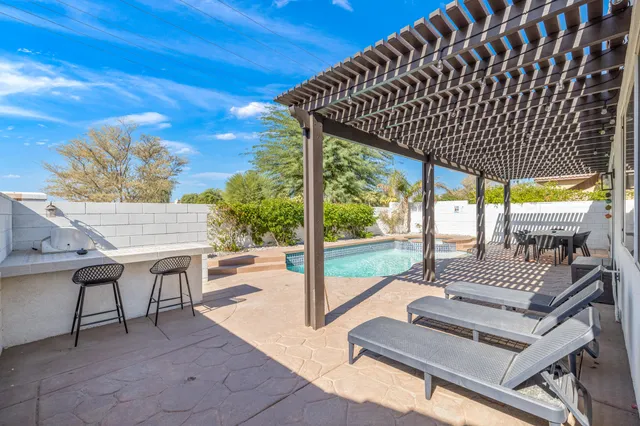 a view of a lake with outdoor space lake view and house in the back