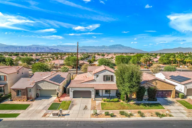 an aerial view of a house with a lake view
