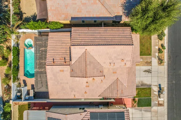 a swimming pool with some trees in the background