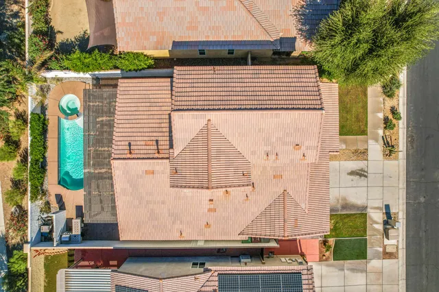 a swimming pool with some trees in the background