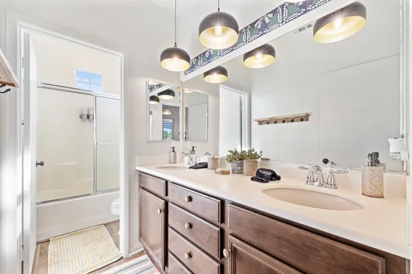 a bathroom with a shower and a toilet