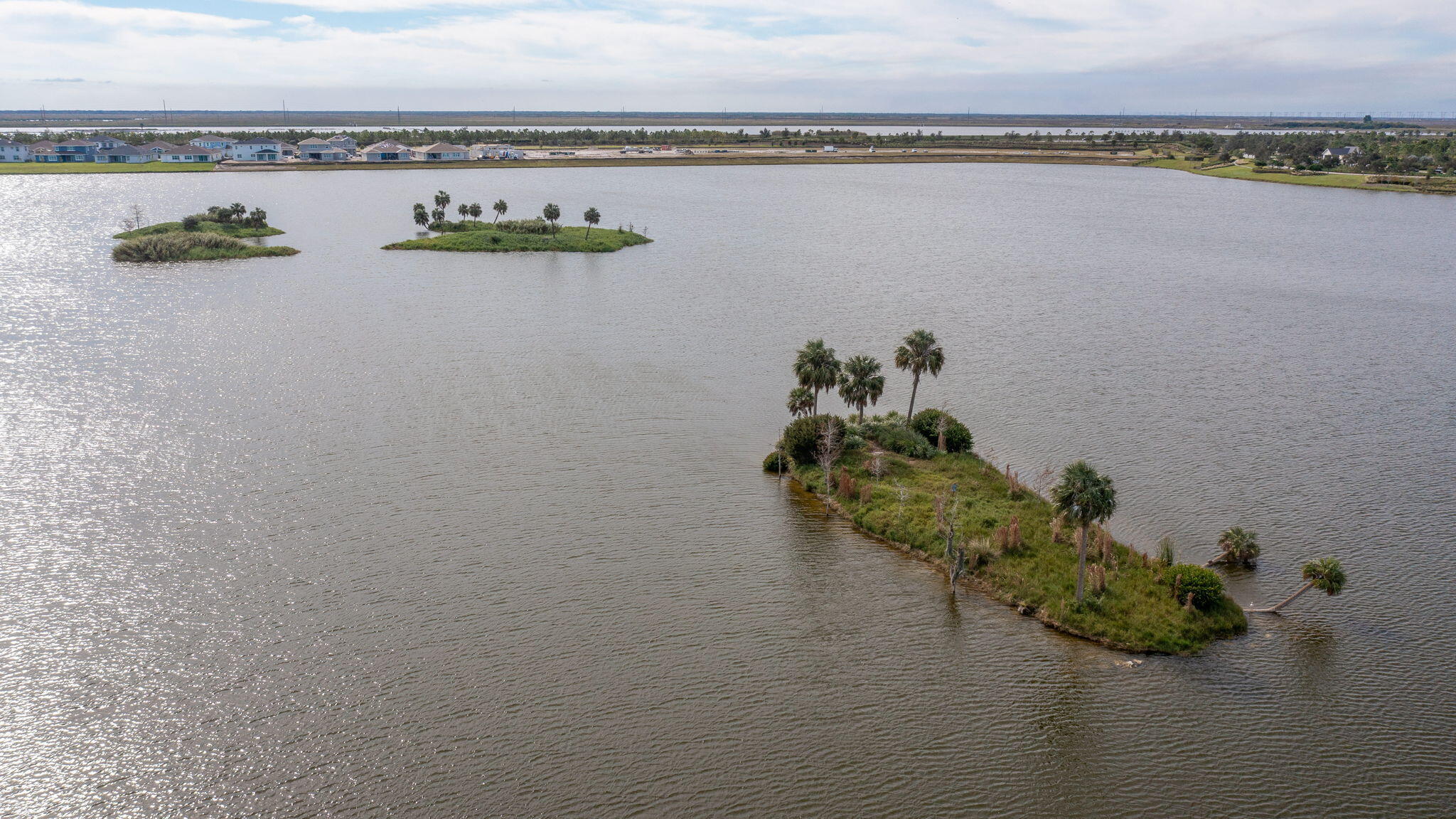 19546 Weathervane Way Loxahatchee, FL 33470 - Photo 51 of 63 a view of a lake with a mountain view