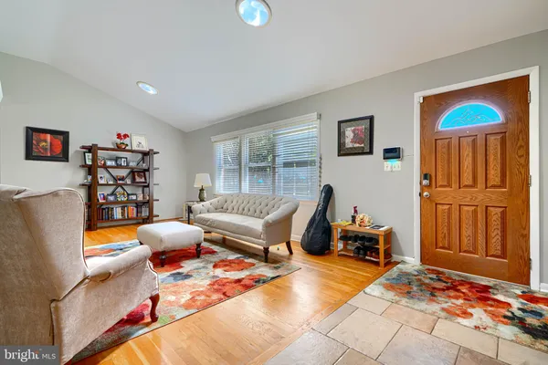 a bedroom with furniture and a flat screen tv