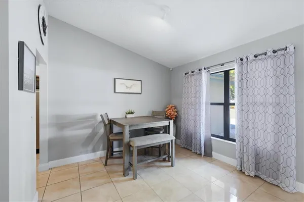 a bedroom with furniture and a window