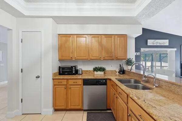 a kitchen with a sink stove top oven and cabinets