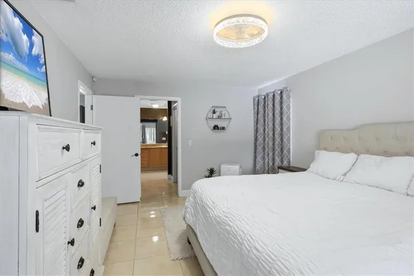 a bedroom with a bed and cabinets