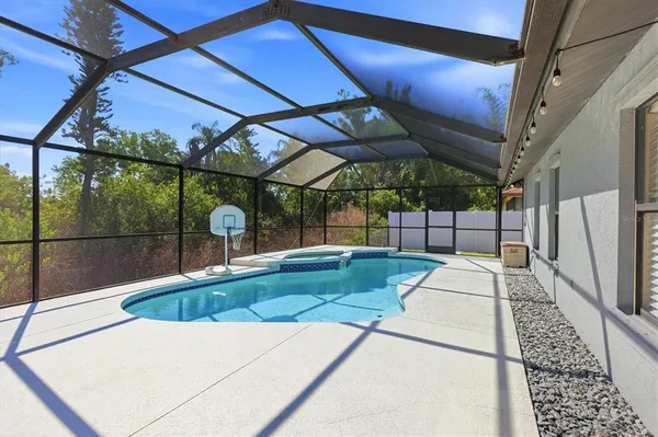 a view of a swimming pool with a patio
