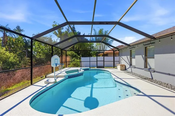 a view of swimming pool with balcony