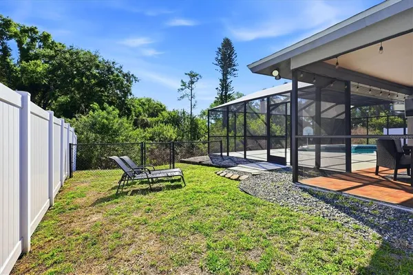 an aerial view of a house with a swimming pool