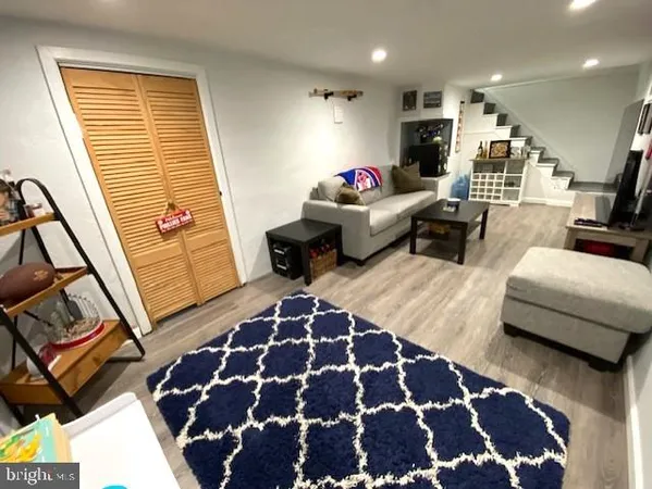 a living room with furniture and a rug