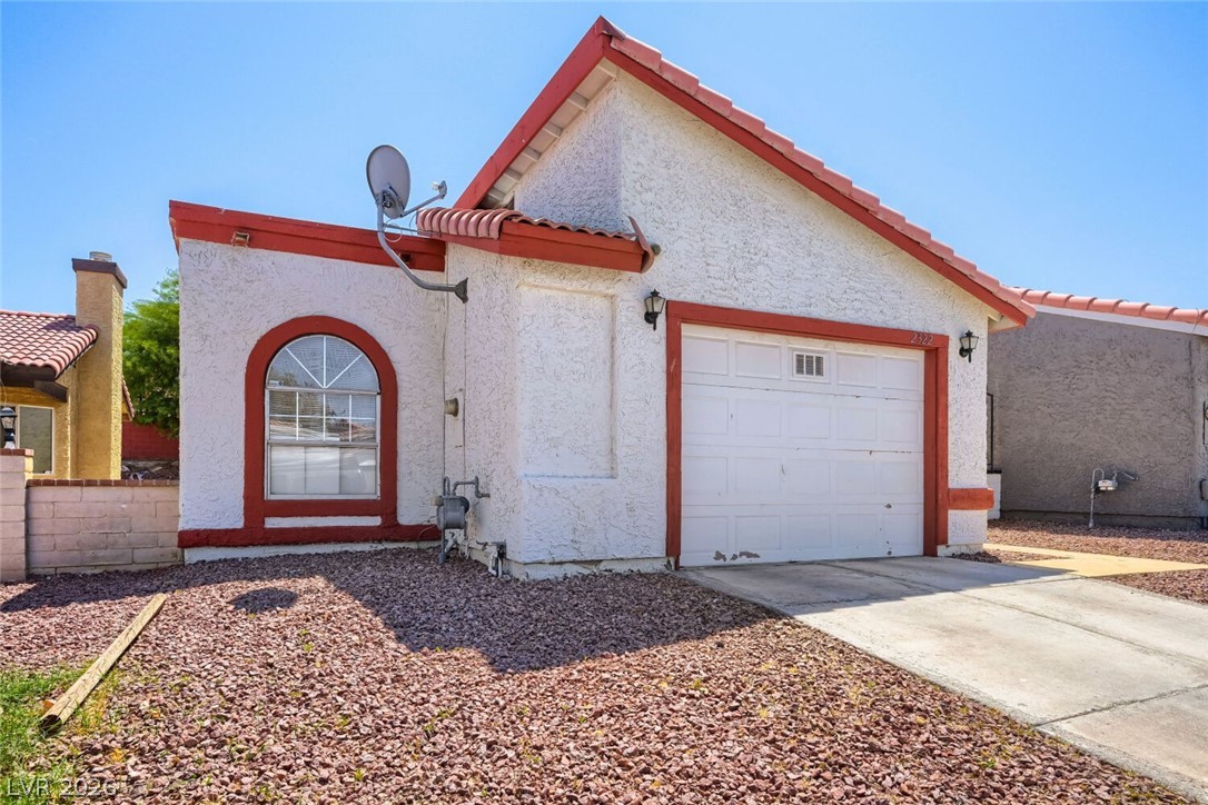 2322 Sabroso Street Las Vegas, NV 89156 - Photo 2 of 17 Facade with red accents welcomes you to this desert oasis.