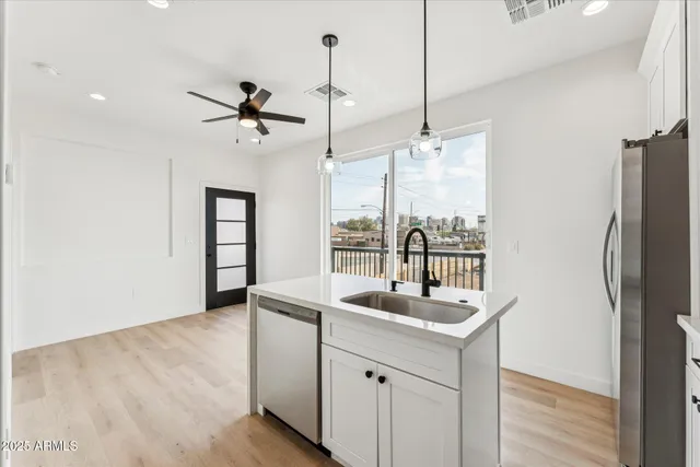 a bathroom with a sink double vanity and a tub