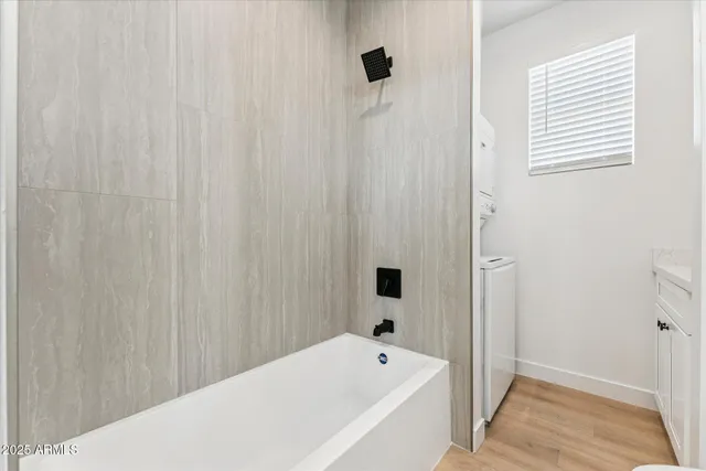 a bathroom with a bathtub and shower
