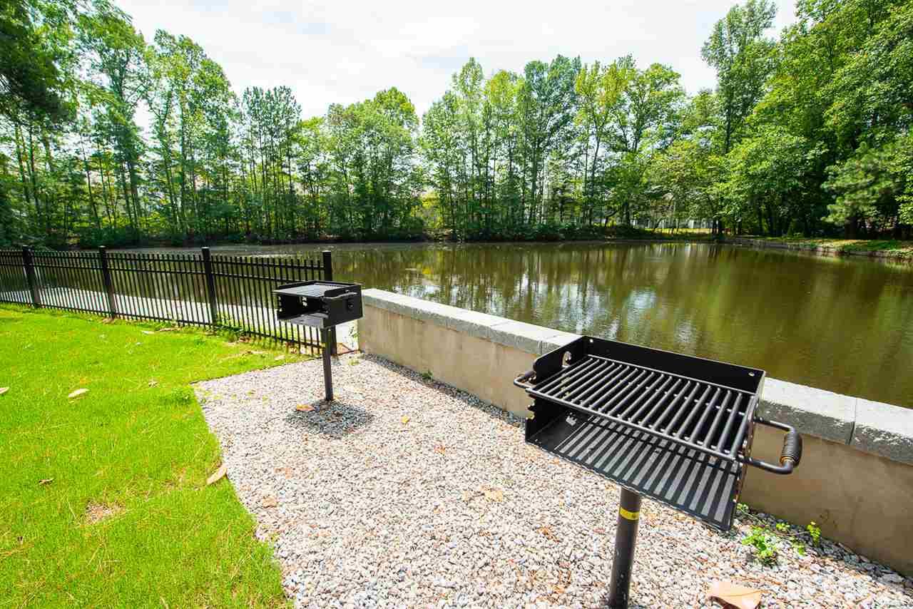 3622 Buffaloe Road, Unit 2 Raleigh, NC 27604 - Photo 7 of 7 a view of a patio with a bench
