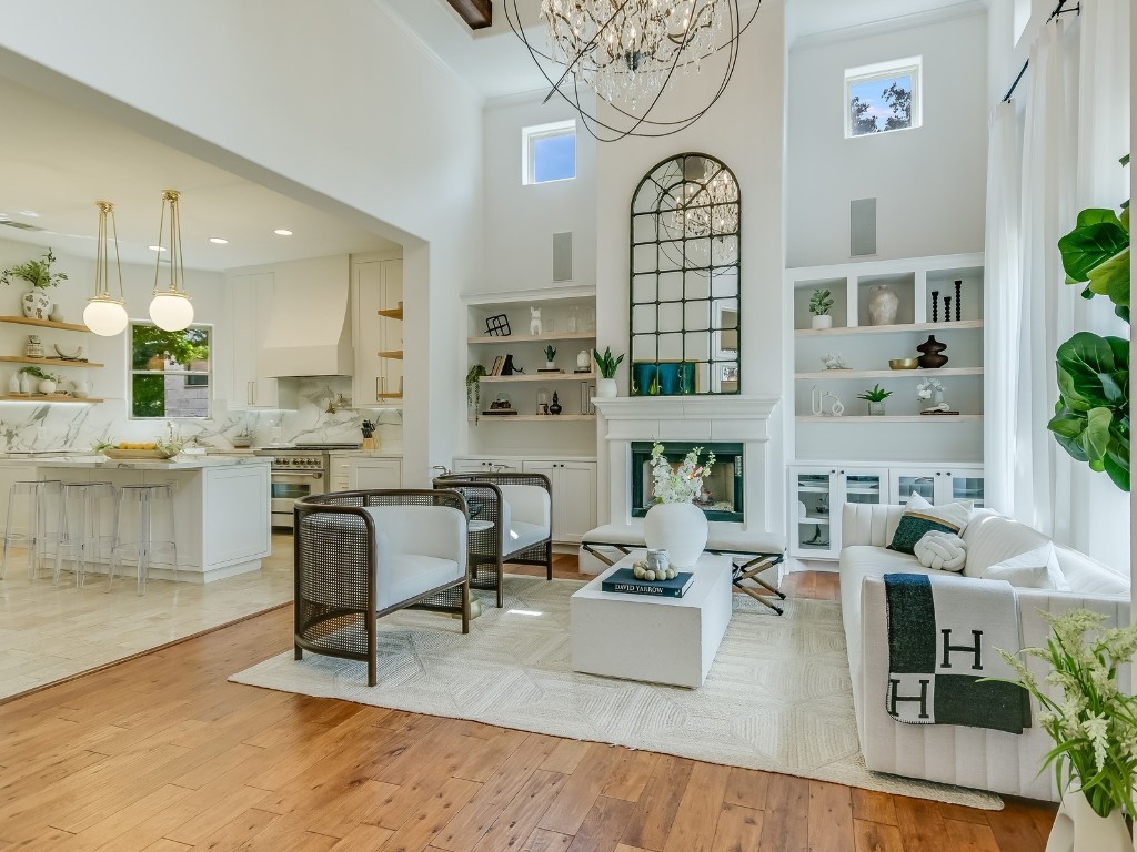 809 Kinney Avenue Austin, TX 78704 - Photo 1 of 1 a living room with fireplace furniture and a large window