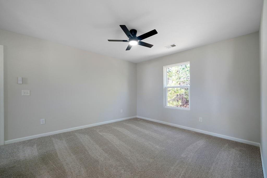 21 Walton Creek Drive Southwest Rome, GA 30165 - Photo 11 of 26 an empty room with windows and fan