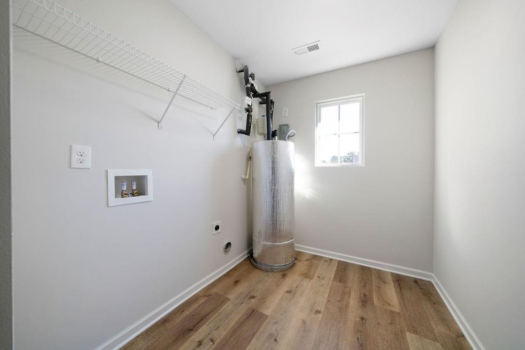 21 Walton Creek Drive Southwest Rome, GA 30165 - Photo 13 of 26 an empty room with wooden floor and windows